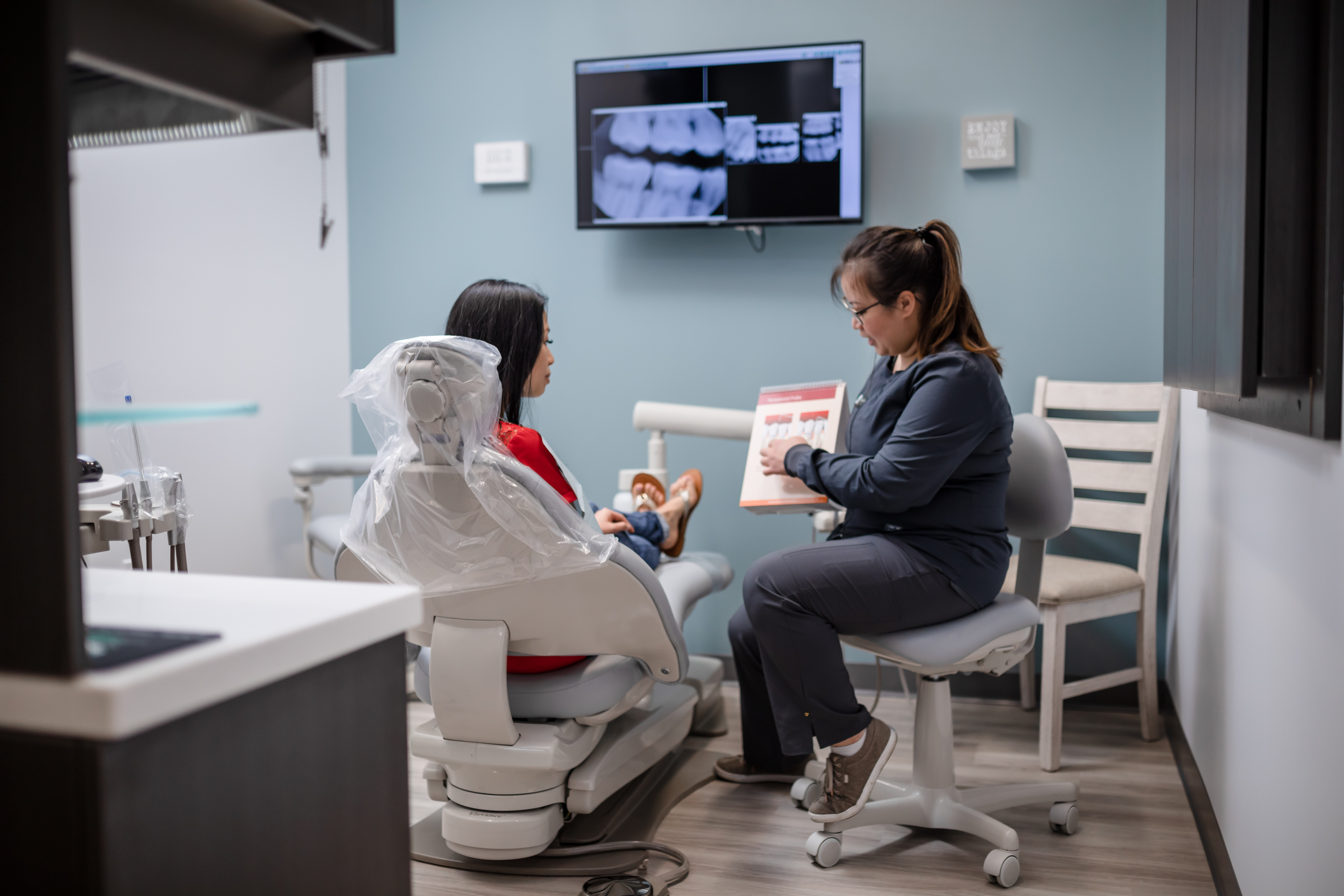 Jade Gan DDS explaining dental treatment plans to a patient