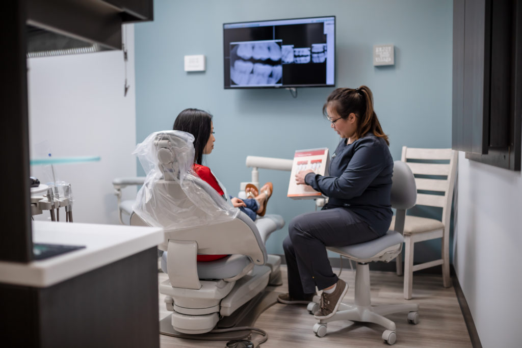 Jade Gan DDS explaining dental treatment plans to a patient